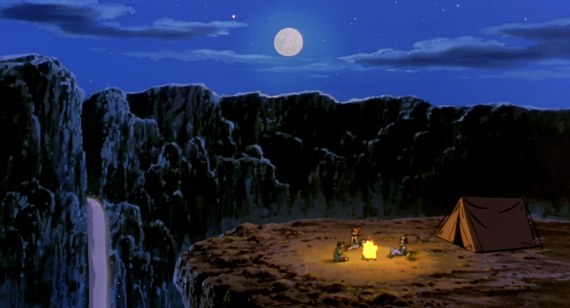 Night scene from Pokémon: The Movie 2000 showing Ash, Pikachu, Brock, and Misty camping by a cliff under a full moon with a tent nearby, rendered in HD anime style.