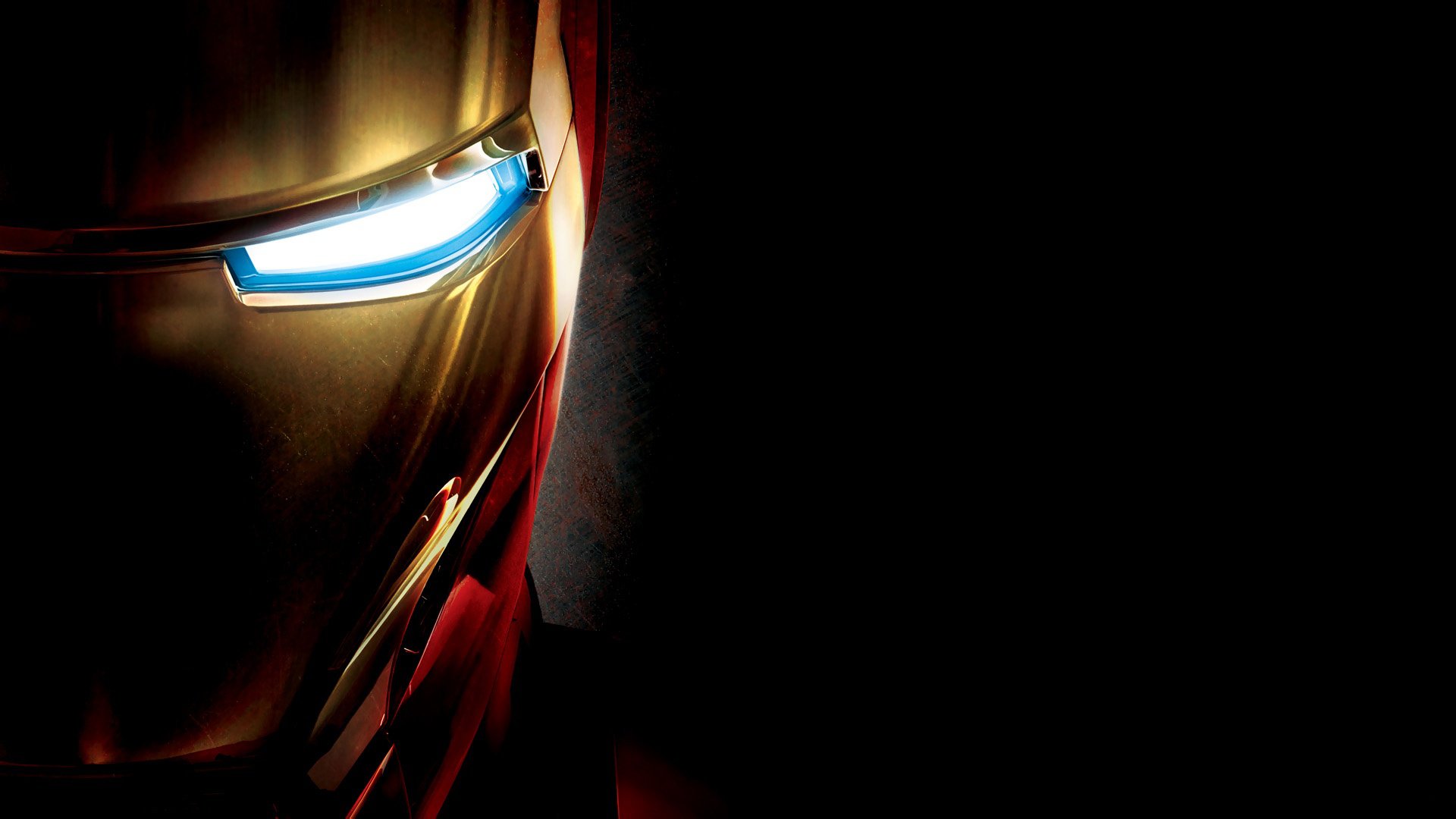 A striking HD desktop wallpaper featuring Iron Man's iconic helmet, showcasing its shiny gold and red design against a dark background.