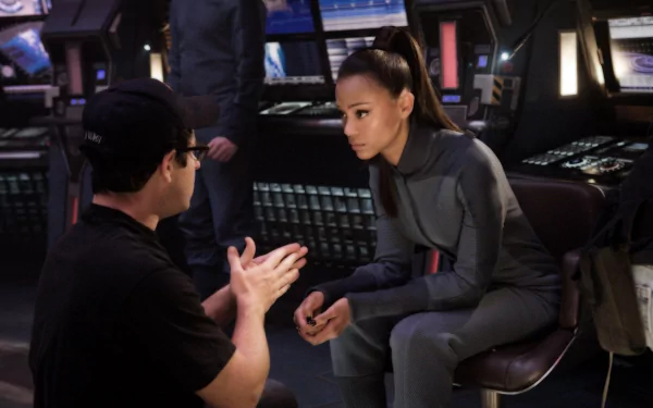 Zoe Saldana on the set of a Star Trek movie, captured in a detailed HD PC desktop wallpaper showing a behind-the-scenes moment.