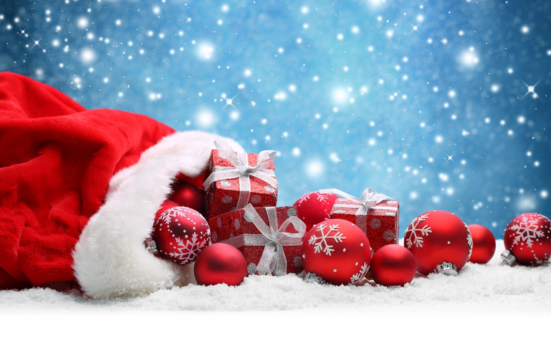 A festive holiday scene with a red Santa hat, red and silver Christmas ornaments, and wrapped gifts on a snowy surface, captured in 4K Ultra HD.