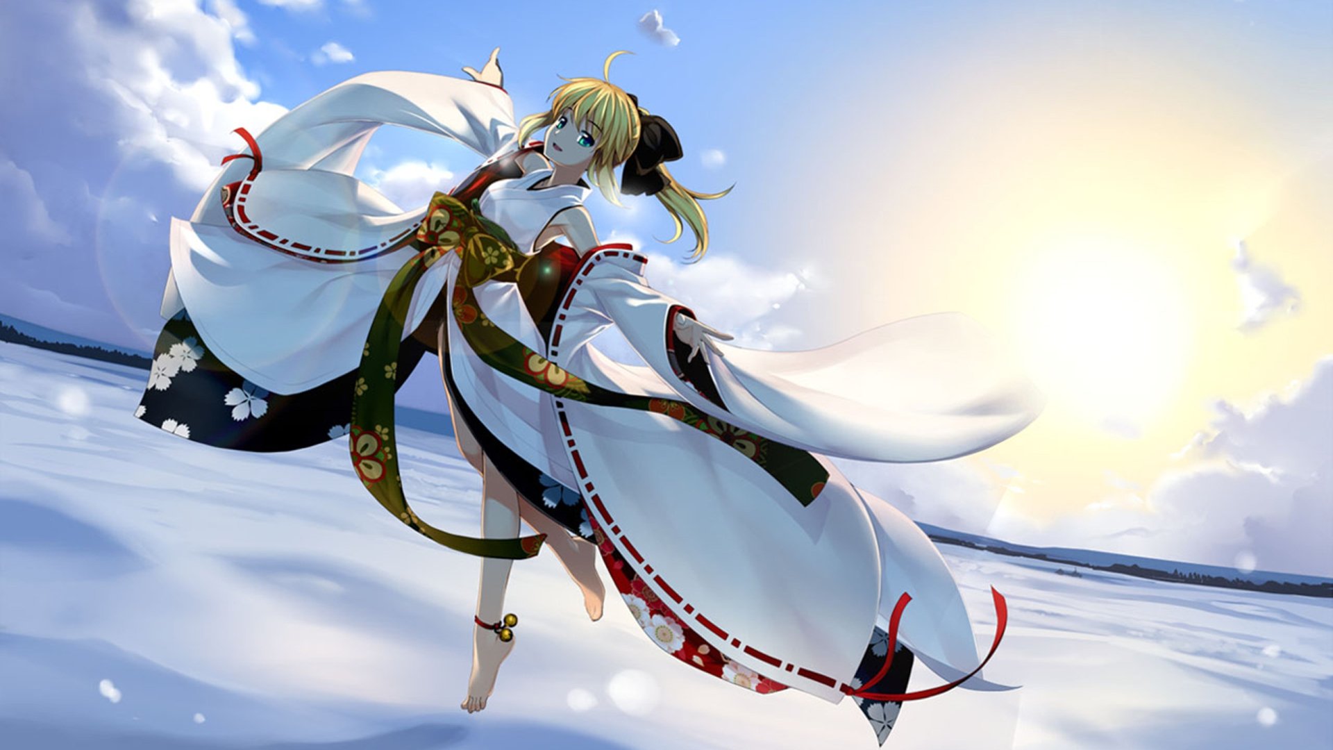 A blonde character with green eyes and a ponytail wears a flowing white dress inspired by Japanese clothing. She poses dynamically against a bright, sunny background in this Fate/Stay Night wallpaper.