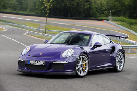 A vibrant purple Porsche 911 GT3 RS parked on a racetrack, showcasing its sleek design and sporty features in this HD PC desktop wallpaper.