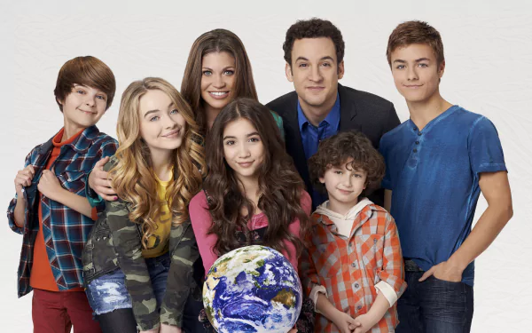 4K Ultra HD Disney desktop wallpaper for the TV show Girl Meets World: seven smiling characters posed on a white backdrop, the center girl holding a globe.