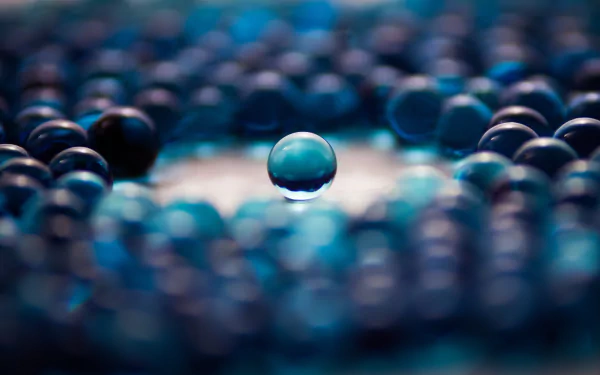An abstract design featuring a central blue ball surrounded by a pattern of darker orbs, creating a captivating visual depth. A stunning 4K Ultra HD desktop wallpaper.