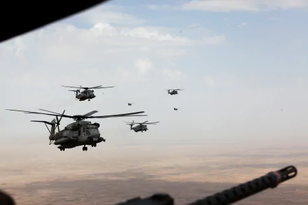 A formation of military helicopters flying over a desert landscape, captured in a 4K Ultra HD PC desktop wallpaper and background.