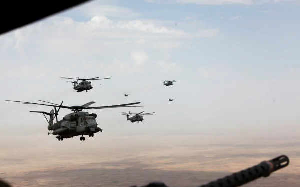 A formation of military helicopters flying over a desert landscape, captured in a 4K Ultra HD PC desktop wallpaper and background.