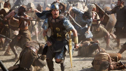 HD desktop wallpaper featuring an intense battle scene from the movie Exodus: Gods and Kings with armored warriors in dynamic motion.