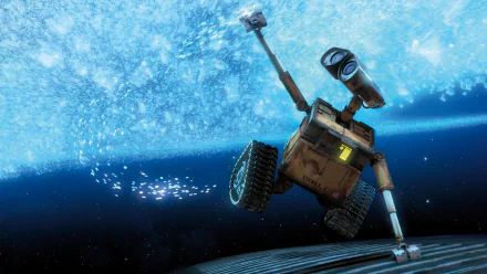 HD PC desktop wallpaper from the movie Wall·E featuring the robot protagonist reaching out against a sparkling blue cosmic background.