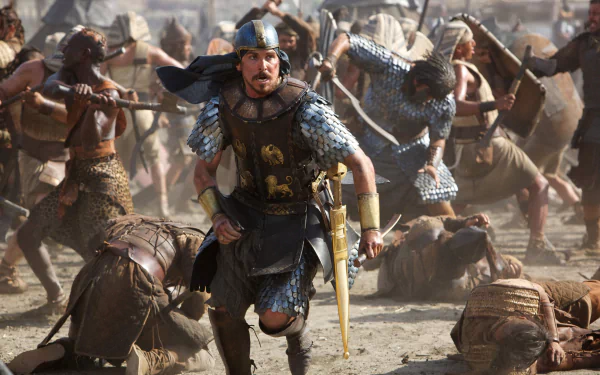 HD desktop wallpaper featuring an intense battle scene from the movie Exodus: Gods and Kings with armored warriors in dynamic motion.
