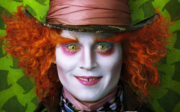 A vibrant HD wallpaper featuring Johnny Depp as the Mad Hatter in the 2010 film Alice in Wonderland, showcasing his iconic orange hair and whimsical makeup against a green background.