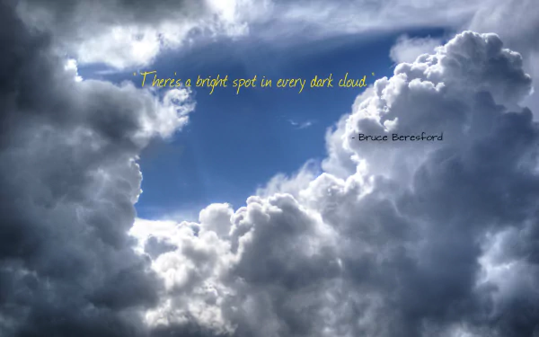 Inspirational 4K Ultra HD PC desktop wallpaper of sky and billowing clouds, a worded quote reads There's a bright spot in every dark cloud across a bright blue opening.