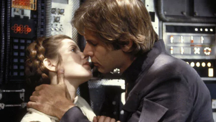 Carrie Fisher and Harrison Ford share a passionate kiss as Princess Leia Organa and Han Solo in a scene from Star Wars Episode V: The Empire Strikes Back.