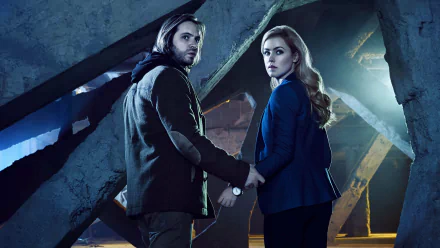 4K Ultra HD desktop wallpaper featuring characters from the TV show 12 Monkeys in a dimly lit, industrial setting, evoking mystery and suspense.