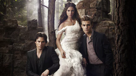 A captivating HD wallpaper from The Vampire Diaries, featuring three main characters posed dramatically amidst a forest backdrop. The scene highlights a mysterious and romantic atmosphere.