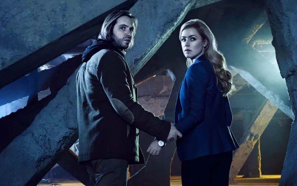 4K Ultra HD desktop wallpaper featuring characters from the TV show 12 Monkeys in a dimly lit, industrial setting, evoking mystery and suspense.