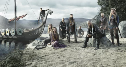 HD wallpaper featuring Ragnar Lothbrok and fellow warriors from the TV show Vikings, with a drakkar (Viking ship) in the background, set against a rugged, coastal landscape.