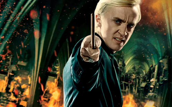 A dramatic HD wallpaper from Harry Potter and the Deathly Hallows: Part 2, featuring a character wielding a wand against a fiery, chaotic backdrop.