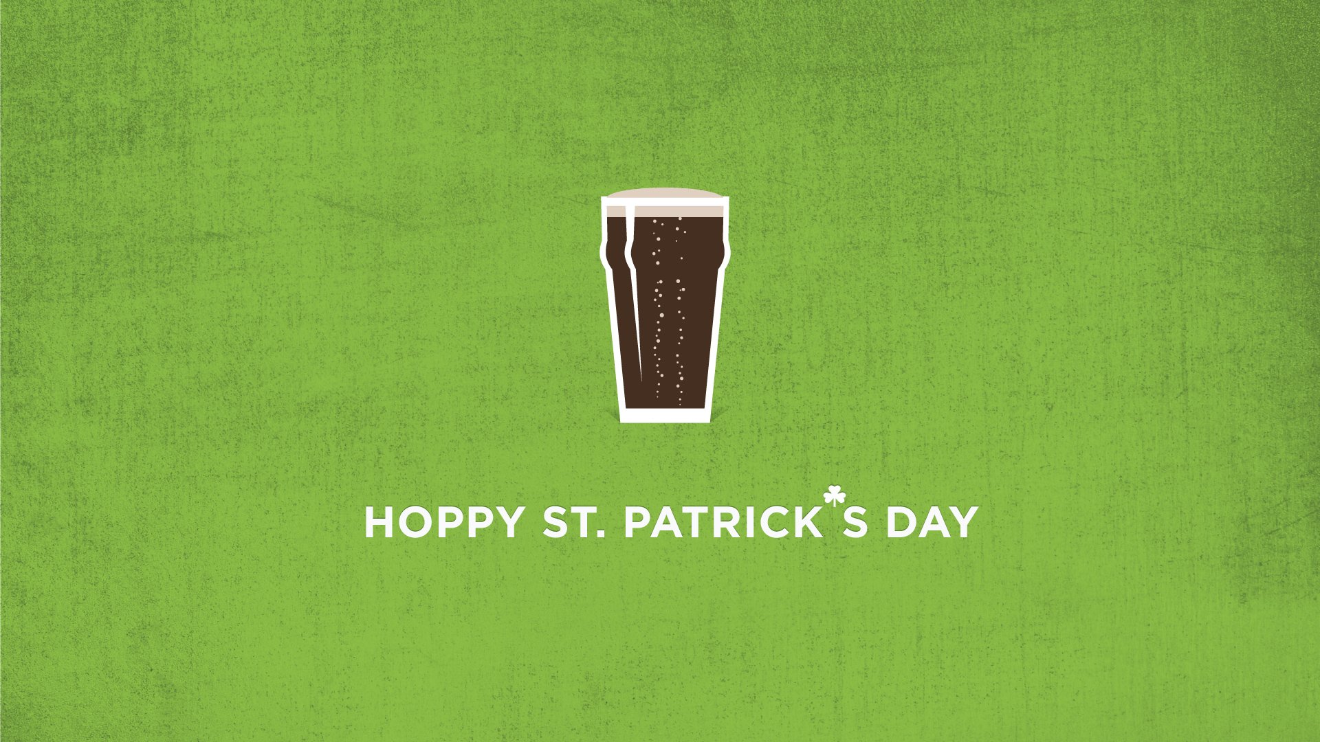 HD desktop wallpaper featuring a Guinness pint icon with the text Hoppy St. Patrick's Day on a green background, celebrating the holiday with a festive touch.