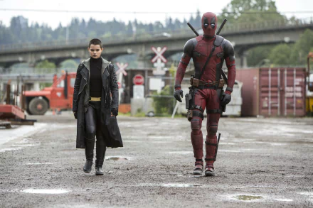 HD wallpaper featuring Negasonic Teenage Warhead (Brianna Hildebrand) and Deadpool from the movie Deadpool, standing in an industrial area.