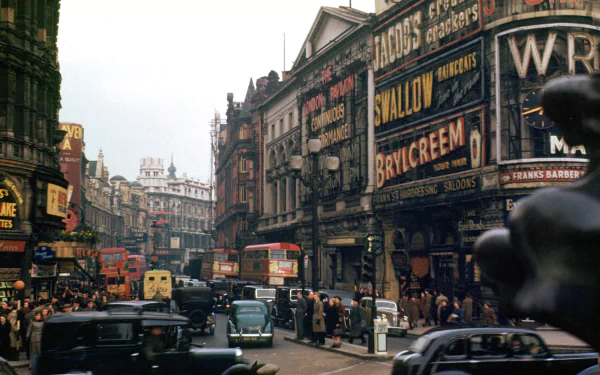 A vibrant vintage scene of a bustling London street, featuring classic cars and iconic advertisements, capturing the essence of the city's rich history and man-made charm.