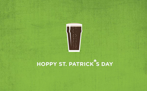 HD desktop wallpaper featuring a Guinness pint icon with the text Hoppy St. Patrick's Day on a green background, celebrating the holiday with a festive touch.