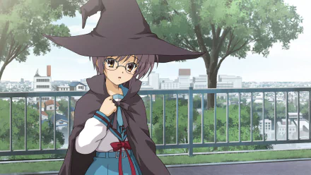 HD desktop wallpaper featuring Yuki Nagato from The Melancholy of Haruhi Suzumiya dressed in a witch costume, standing by a railing with a cityscape and trees in the background.