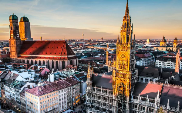 A stunning HD cityscape of Munich, Germany showcasing iconic man-made architecture, including historic churches and buildings under a clear sky.