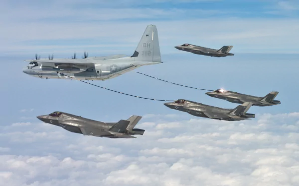 A Lockheed Martin C-130J Super Hercules refuels multiple Lockheed Martin F-35 Lightning II warplanes mid-flight above the clouds in this HD military aircraft wallpaper.