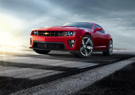 Red Chevrolet Camaro ZL1 muscle car on a racetrack, front three-quarter view; 2K Quad HD PC desktop wallpaper and background showcasing the Chevrolet vehicle.