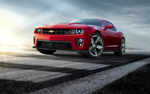 Red Chevrolet Camaro ZL1 muscle car on a racetrack, front three-quarter view; 2K Quad HD PC desktop wallpaper and background showcasing the Chevrolet vehicle.