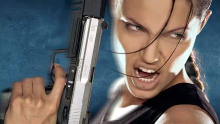 Angelina Jolie as Lara Croft in Tomb Raider, holding a gun with an intense expression, featured in an HD PC desktop wallpaper and background.