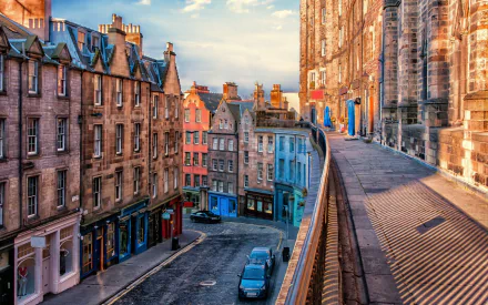 A vibrant Edinburgh street scene showcasing charming architecture, colorful buildings, and a scenic pathway, capturing the essence of the city's unique urban landscape.