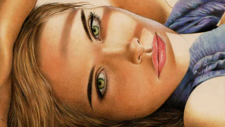 Close-up HD desktop wallpaper of a blonde woman's face with vivid green eyes, soft makeup and a blue top, reclining and gazing toward the viewer.