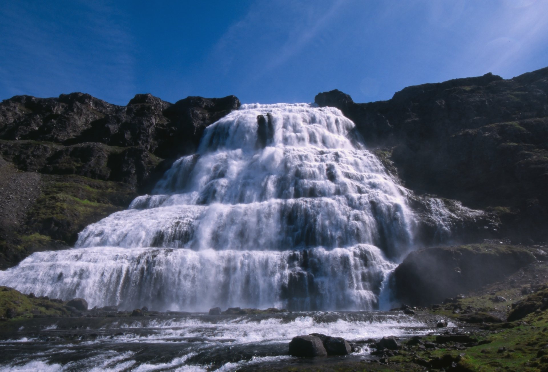 Dynjandi waterfall in Iceland cascading in layered tiers beneath a blue sky — vivid nature scene, HD PC desktop wallpaper and background.