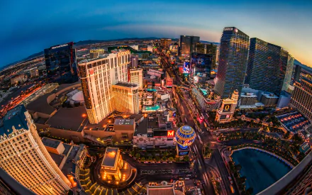 Fisheye lens view of Las Vegas at twilight, capturing the vibrant lights and bustling streets as an HD desktop wallpaper.