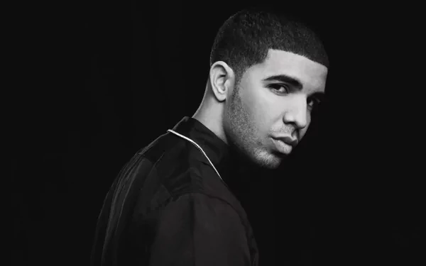4K Ultra HD wallpaper featuring music artist Drake in a striking black-and-white portrait, showcasing his iconic profile against a dark background.