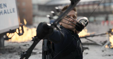 HD desktop wallpaper featuring Hawkeye, portrayed by Jeremy Renner, in an action scene from Captain America: Civil War, aiming his bow amidst a fiery backdrop.
