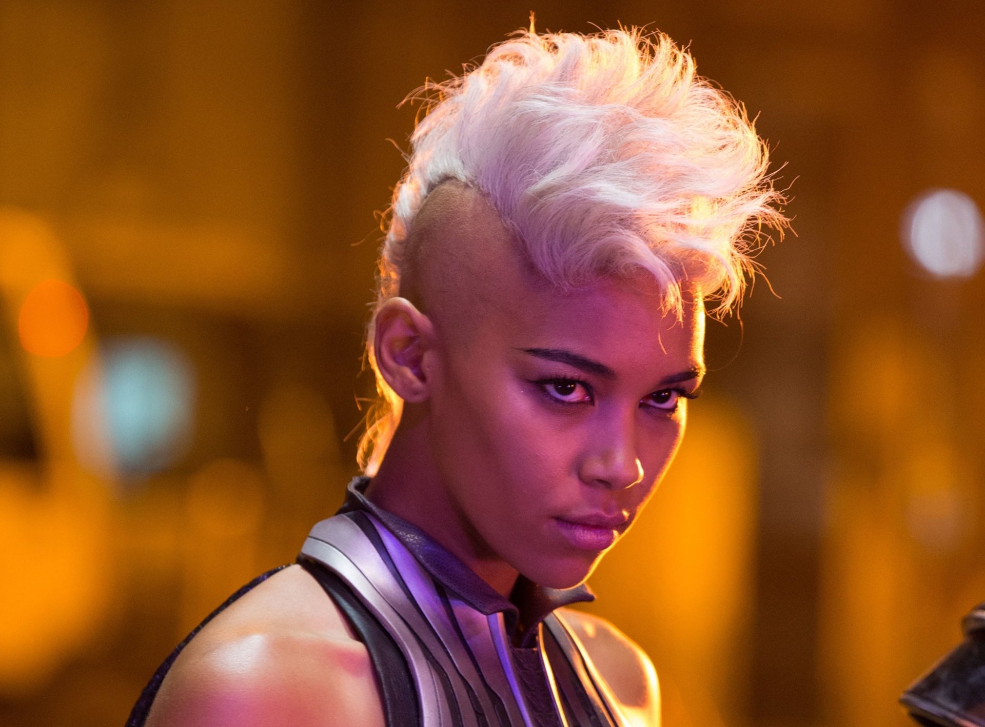 Alexandra Shipp as Storm in a dramatic pose from the movie X-Men: Apocalypse, featuring her iconic platinum hair and striking presence. HD wallpaper background.