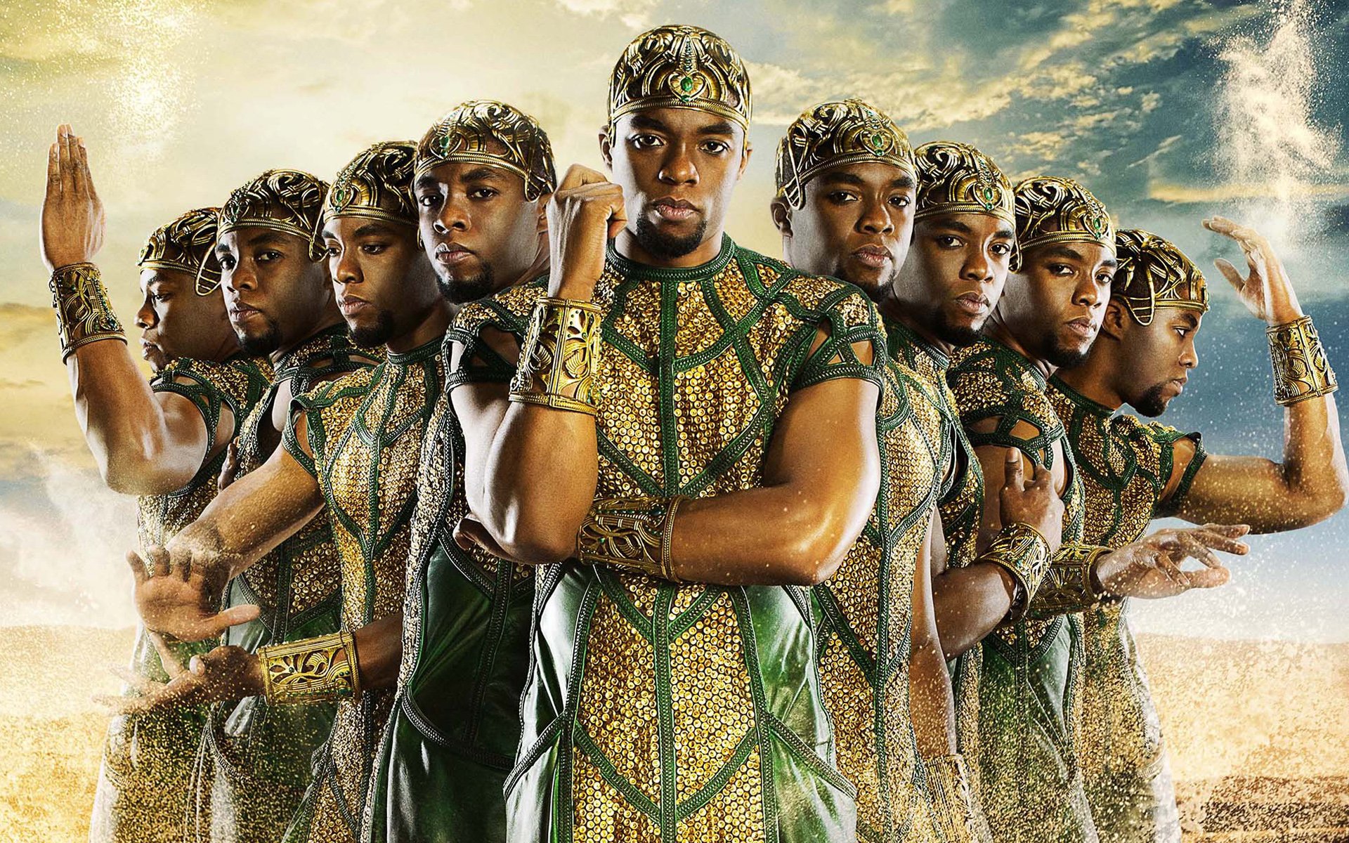 HD PC desktop wallpaper and background from the movie Gods Of Egypt: mirrored rows of regal warriors in gold-and-green armor posed against a sunlit desert and dramatic sky.