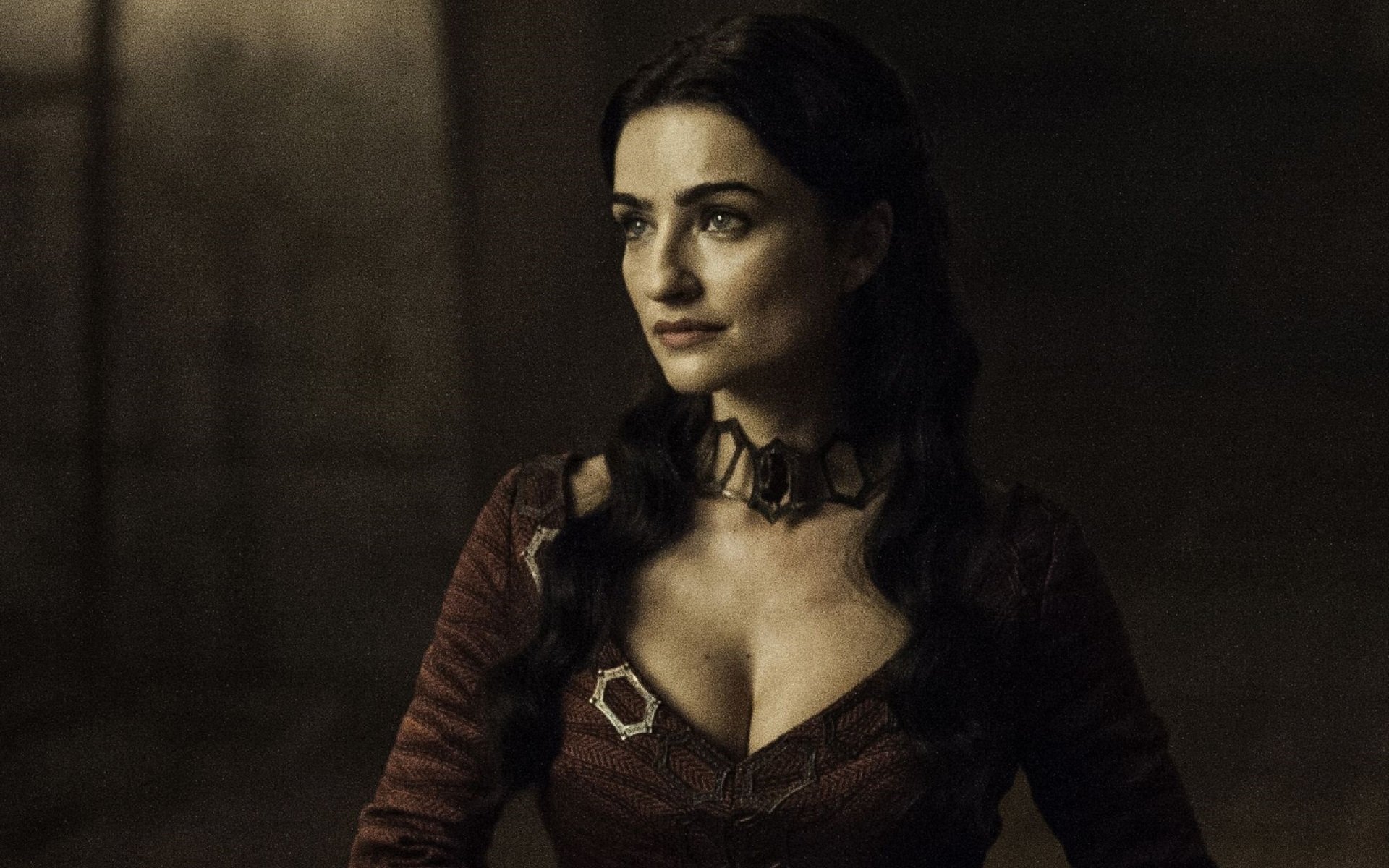 A captivating HD wallpaper from the TV show Game of Thrones featuring a character in a dramatic pose, highlighting intricate details and a moody background.