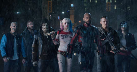 HD desktop wallpaper featuring the characters from the movie Suicide Squad standing together in the rain.