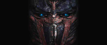 HD wallpaper featuring Optimus Prime from the movie Transformers: Age of Extinction, showcasing his iconic armored face with striking blue eyes.