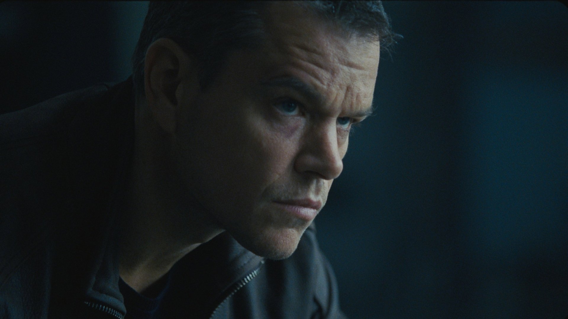 HD PC desktop wallpaper featuring Matt Damon in a close-up from the movie Jason Bourne, showcasing intense expression and dramatic lighting.