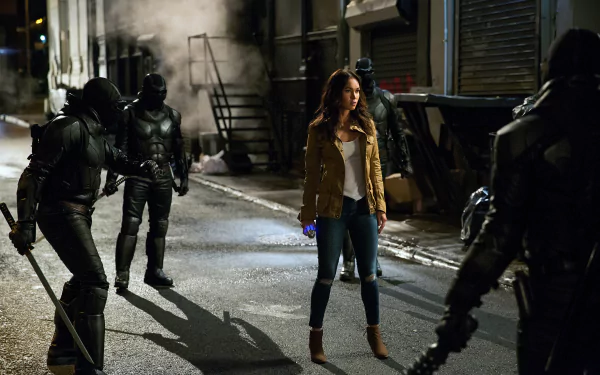 Megan Fox as April O’Neil in a scene from Teenage Mutant Ninja Turtles: Out Of The Shadows, featured in a 4K Ultra HD PC desktop wallpaper.