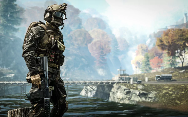 A soldier stands confidently with a rifle by a serene riverbank, showcasing stunning visuals from Battlefield 4 in a captivating HD wallpaper.