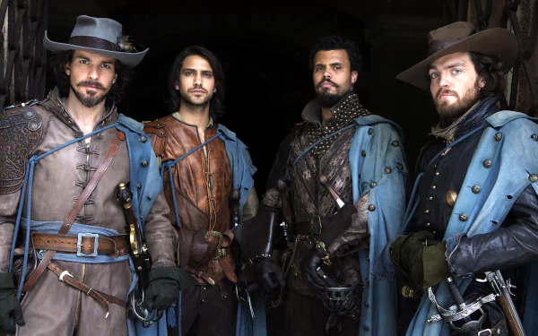 HD PC desktop wallpaper featuring the four lead characters from the TV show The Musketeers dressed in period costumes with swords.