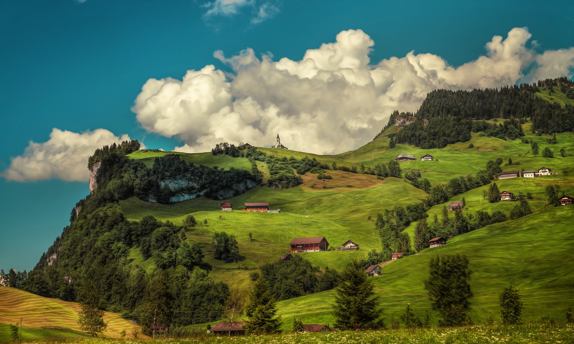A vibrant summer landscape featuring green hills under fluffy white clouds, captured in stunning 4K Ultra HD photography for a PC desktop wallpaper.