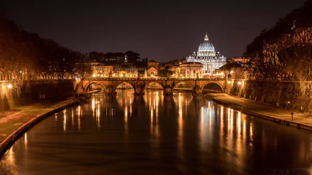A serene night view of the illuminated bridges over the river in Rome, reflecting the soft lights against the water, with the iconic dome of St. Peter’s Basilica in the background.