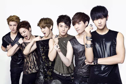 HD desktop wallpaper featuring members of Exo in stylish outfits posing for the camera.