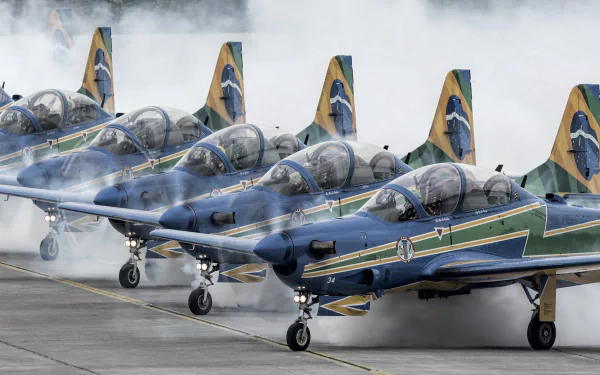 HD desktop wallpaper featuring a lineup of military aircraft at an air show, with pilots preparing for takeoff amid smoky atmosphere.